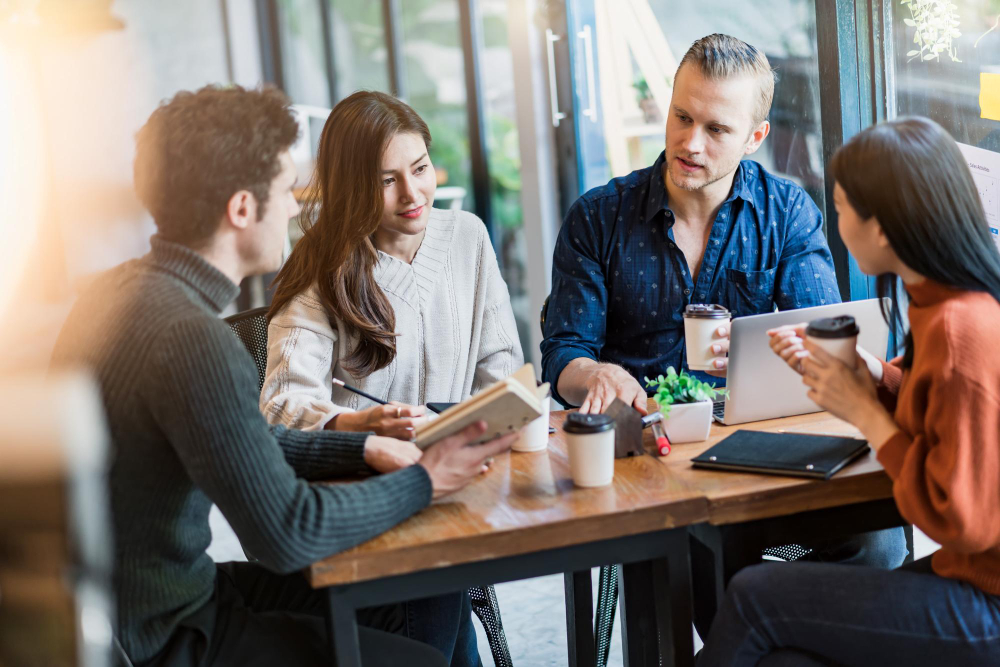 Professionals collaborating in a bright workspace